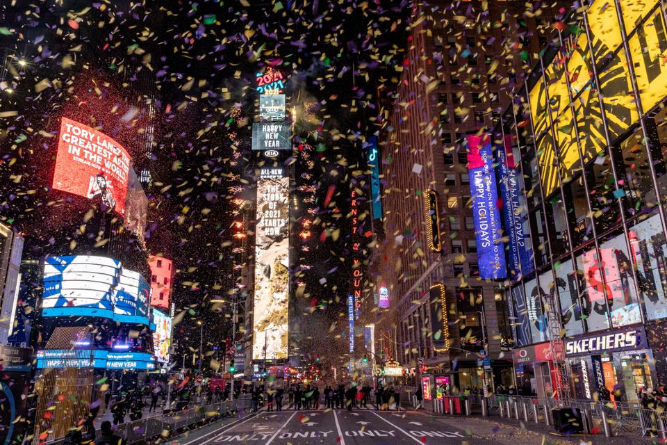 Confetti flies around the ball and countdown clock in Times Square during the virtual New Year's Eve event following the outbreak of the coronavirus disease (COVID-19) in the Manhattan borough of New York City, New York, U.S., January 1, 2021. REUTERS/Jeenah Moon